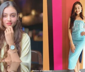 A Gujarati film actress, Janki Bodiwala, sits on a chair in a beautiful pose. On the other side, she stands in front of the coloring wall in a charming pose.