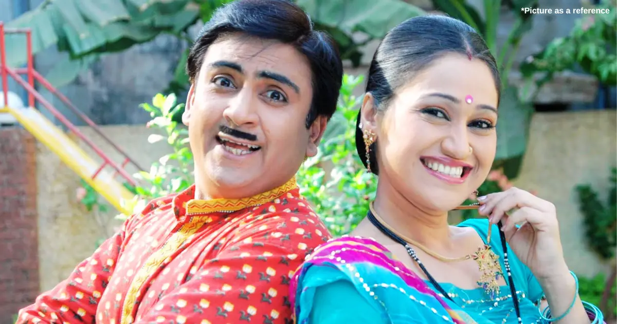 Indian and Gujarati actors Disha Vakani and Dilip Joshi wear traditional Gujarati clothes and stand with a smiley face.