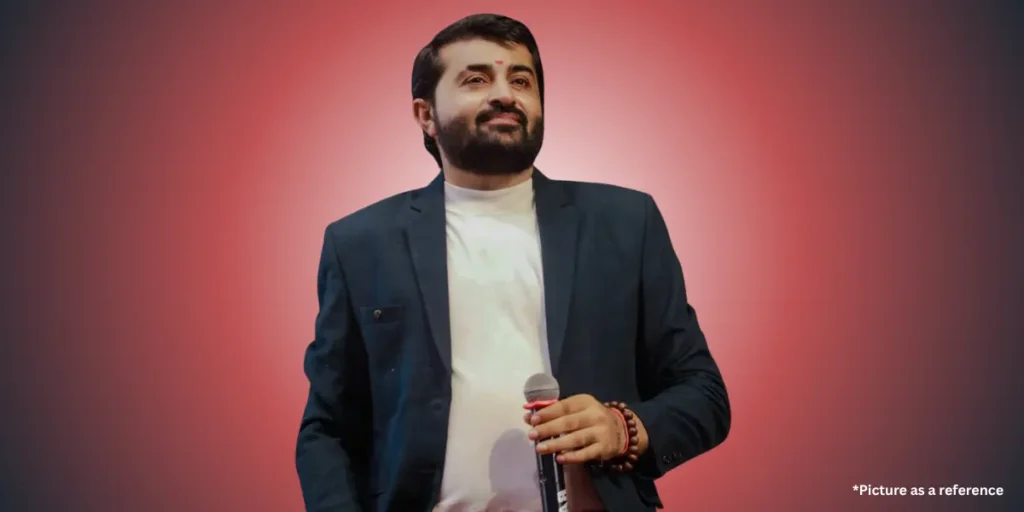 Devayat Khavad is wearing professional clothes colorful gradient background.