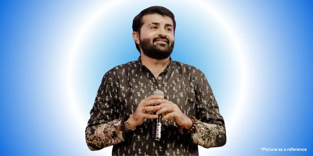 Devayat Khavad is wearing traditional clothes on a colorful gradient background.