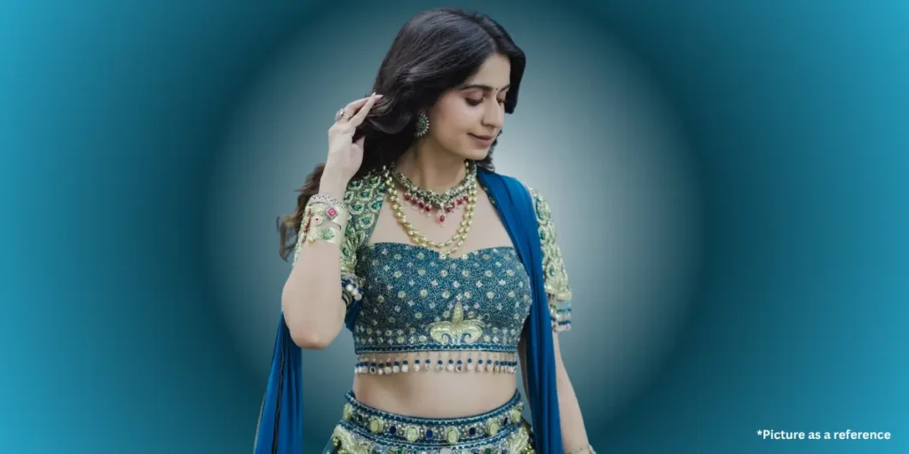 Kinjal Dave is in a blue embellished lehenga choli with matching jewelry.