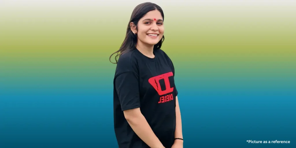 Aarti Sangani smiling in a black t-shirt against a green and blue gradient background.