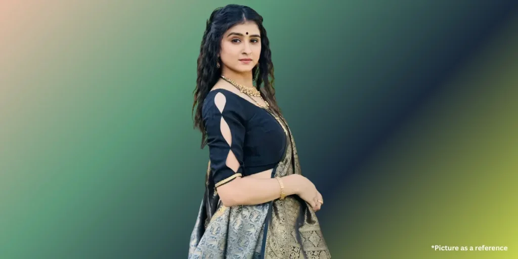 Gujarati actress Geet Thakkar (ગીત ઠક્કર) stands in a black and silver saree.