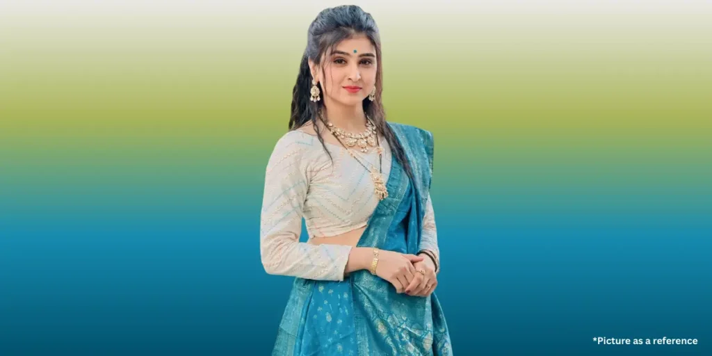 Indian actress Geet Thakkar in a teal blue saree and a white embroidered blouse.