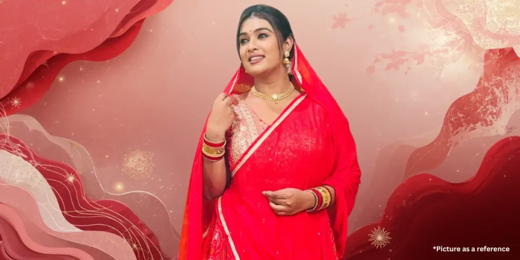 Chhaya Thakor in traditional red Gujarati ethnic wear with gold jewelry, posing for a professional photoshoot.