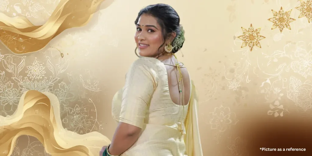 Gujarati Chhaya Thakor side profile in an elegant cream-colored designer saree with a traditional braided hairstyle.