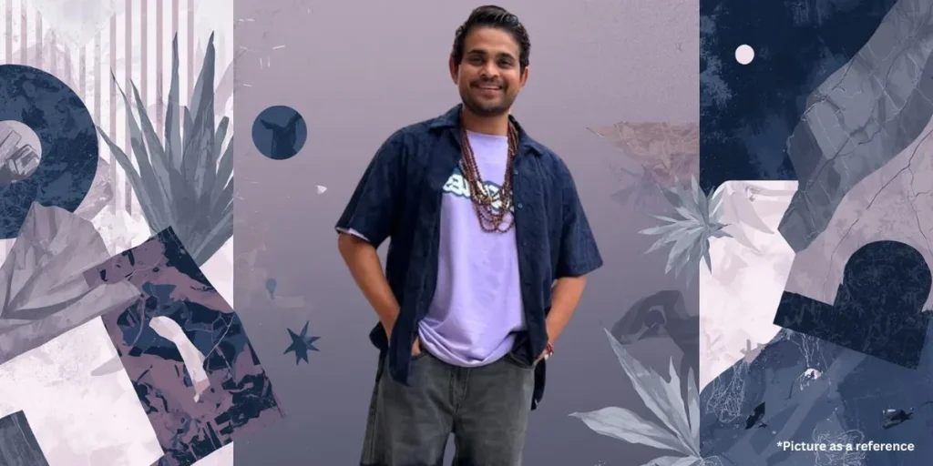 A smiling portrait of Khajur Bhai (Nitin Jani) in a purple t-shirt and dark blue shirt against a lavender artistic background with floral elements.